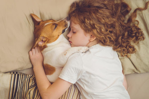 Child Breathing with their Dog