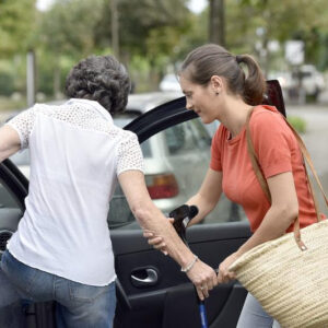 Woman getting in a car