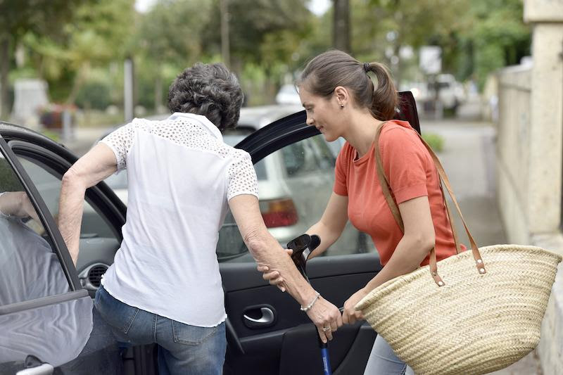 Woman getting in a car