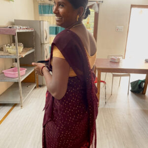 Indian woman standing and smiling
