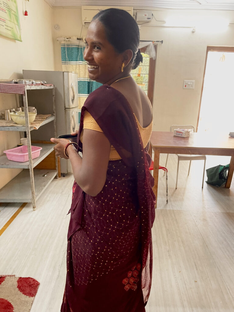 Indian woman standing and smiling