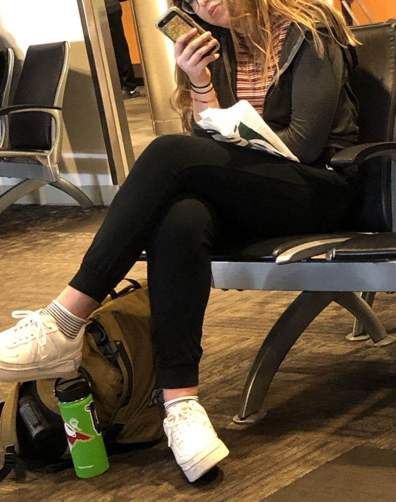 Woman reading folding her knees