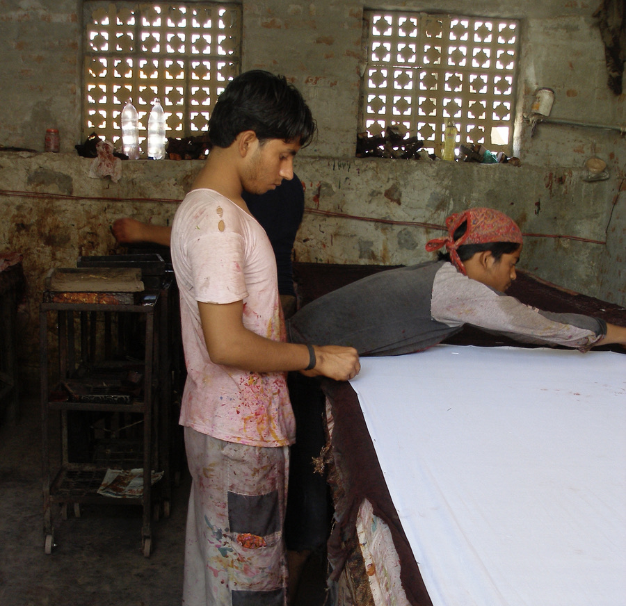 Two gentlemen working in a shop