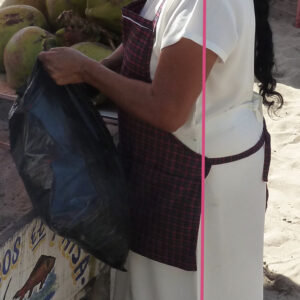 Woman standing selling watermelons