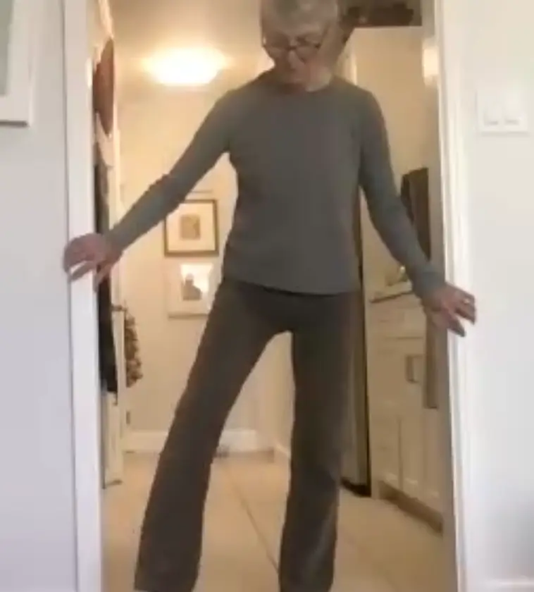 Jean releases tension in a door way