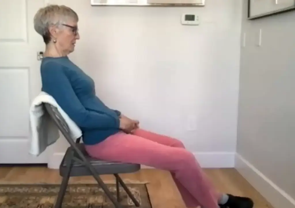 Jean is reclining in a chair