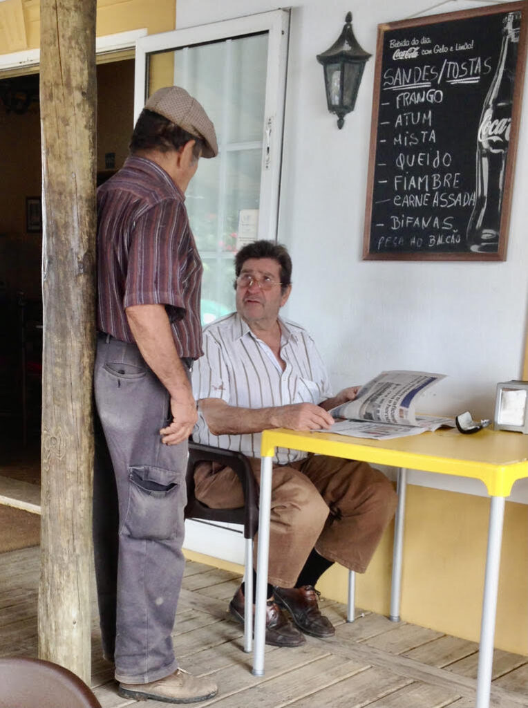 Man Standing - man sitting down